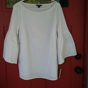 Zac and Rachel white top with bell sleeves.